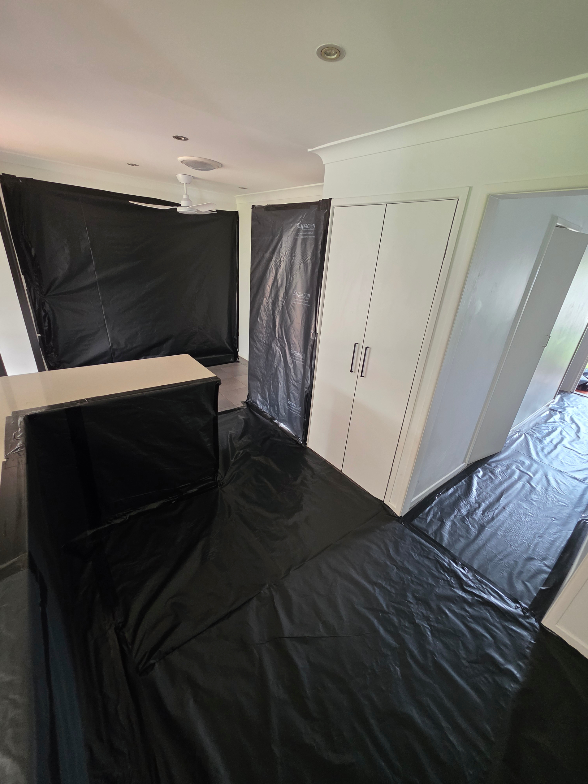 Residential_2 Irwin Services residential asbestos removal team working safely at Brisbane house